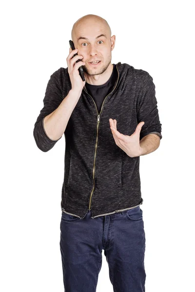 Mladý muž používající mobilní telefon — Stock fotografie