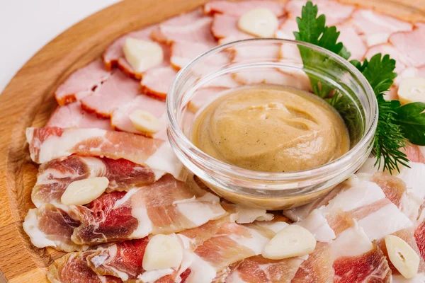 Delicious lard with mustard on wooden cutting board with spices. — Stock Image Delicious lard with mustard on wooden cutting board with spices. Stock Picture