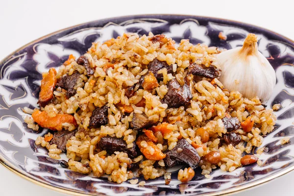 Pilaf with lamb meat and vegetables. Cooked with fried lamb, rice — Stock Photo, Image