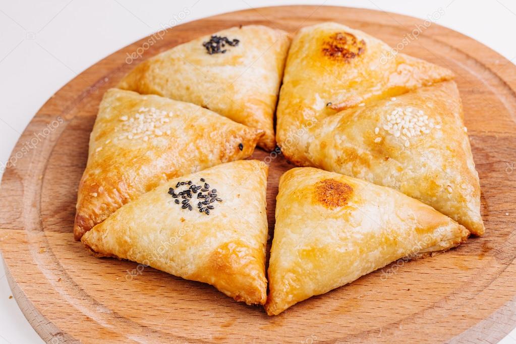 Delicious samosa pies with meat on plate. Menu, restaurant, recipe concept.