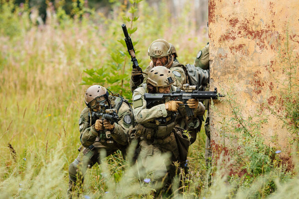 group of soldiers attacking from behind cover