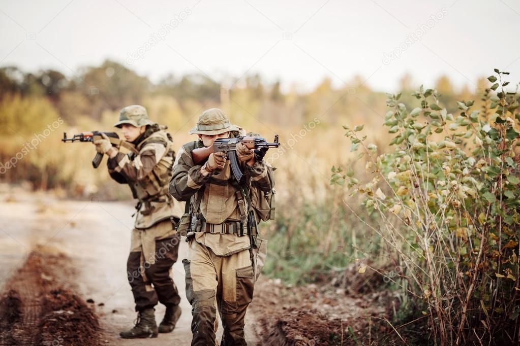 Two soldiers are exploring an unfamiliar area