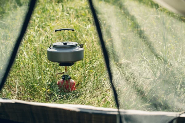 Boiling water in kettle on portable camping stove — Stock Photo, Image