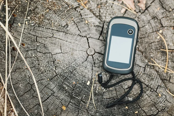 Navigator lying on a wooden surface — Stockfoto