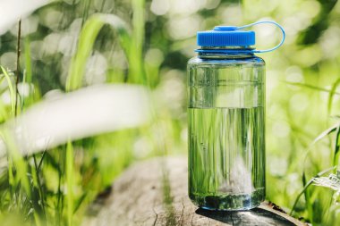 Water bottle on wood  with summer 