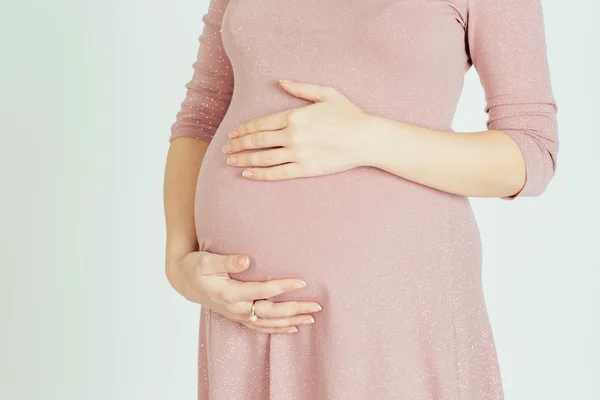 A pregnant mother holding her belly — Stock Photo, Image