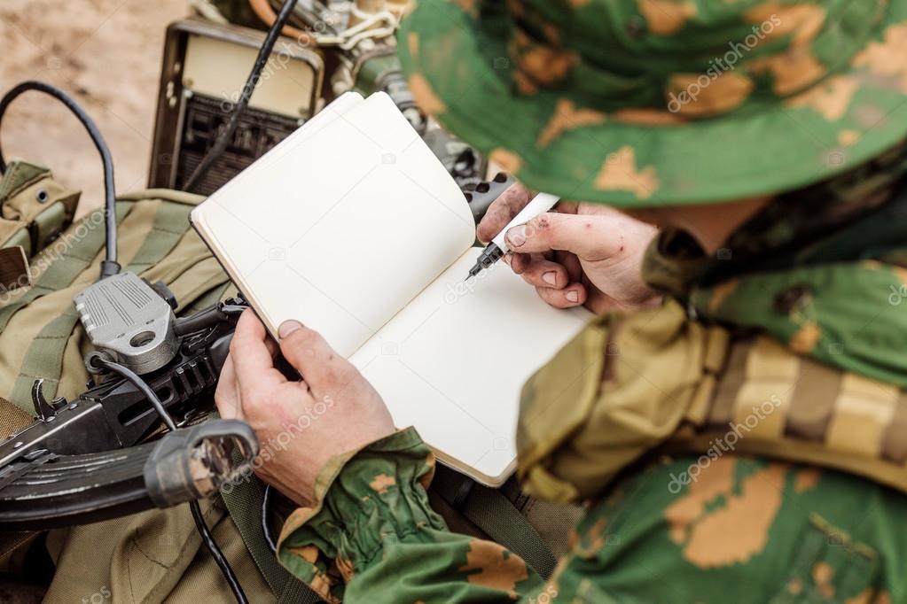 radio operator taking notes and radio