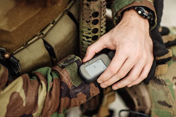 Ranger holding gps in hand and determines the location of coordi — Stock Photo, Image