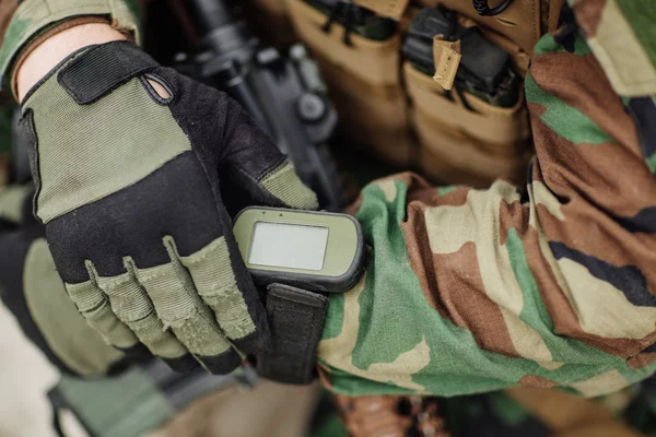 Ranger holding gps in hand and determines the location of coordi — Stock Photo, Image