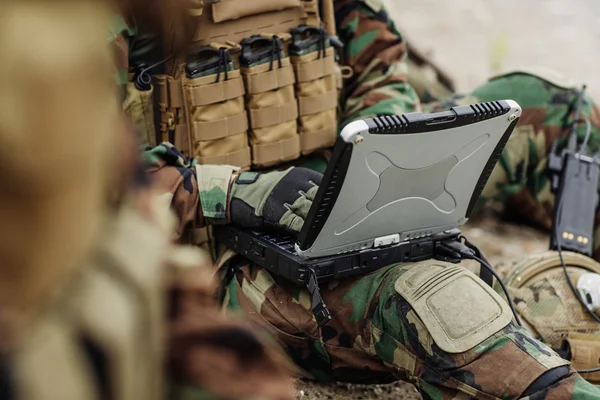 Ranger using laptop outdoors — Stock Photo, Image