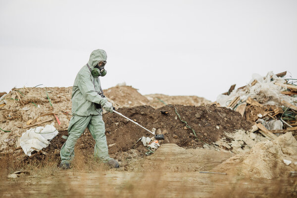 Scientist (radiation supervisor) in protective clothing and gas