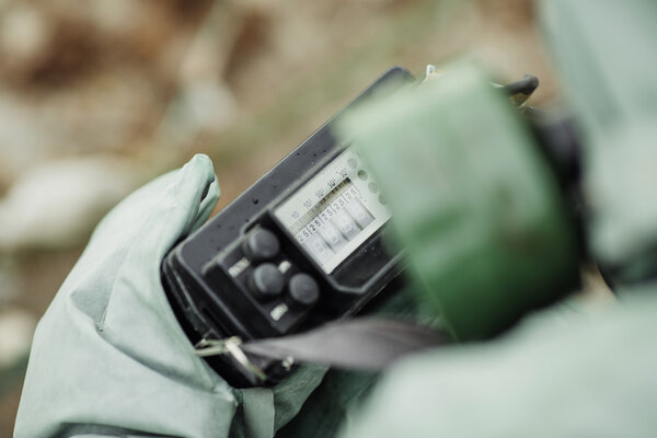 Scientist (radiation supervisor) in protective clothing and gas