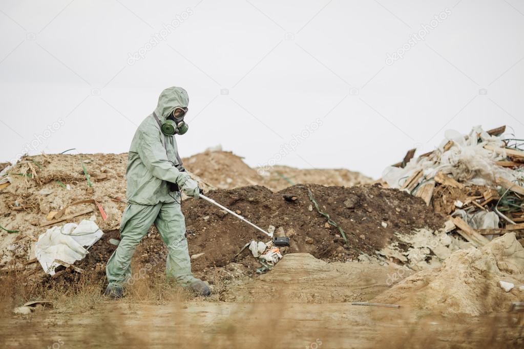 Scientist (radiation supervisor) in protective clothing and gas