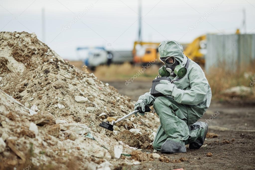 Scientist (radiation supervisor) in protective clothing and gas — Stock