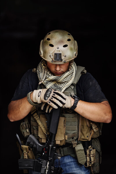 Terrorist during the special secret operation on dark background