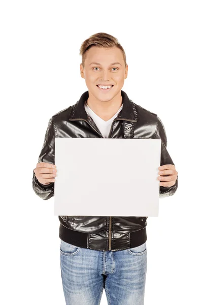 Young man holding a blank panel against a white background — Stock Photo, Image