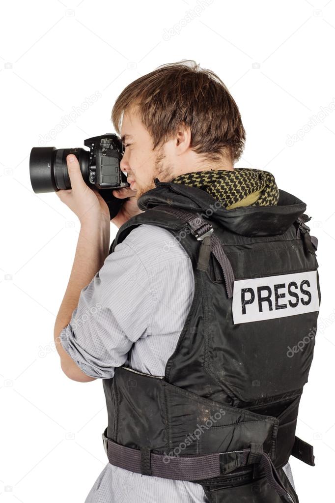 press photographer wears a protective vest and takes photos with