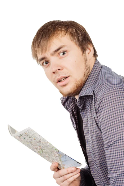 Young man with map on a white background — Stockfoto