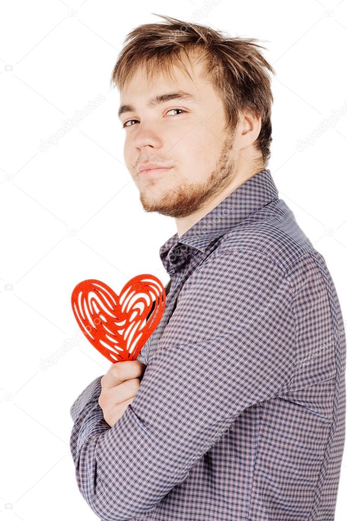 man holding a red heart on his hand isolated on a white backgrou