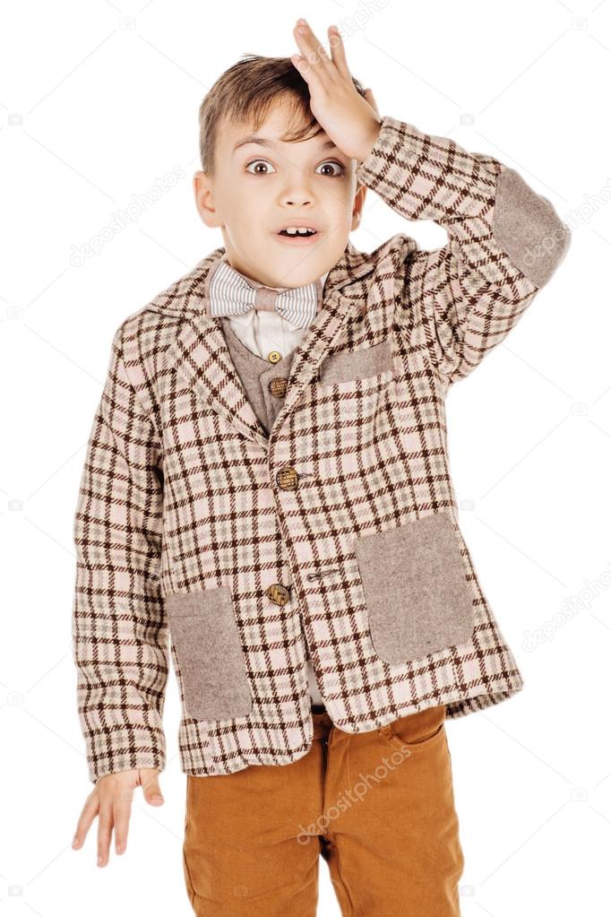 Portrait adorable young happy boy looking at camera isolated on 