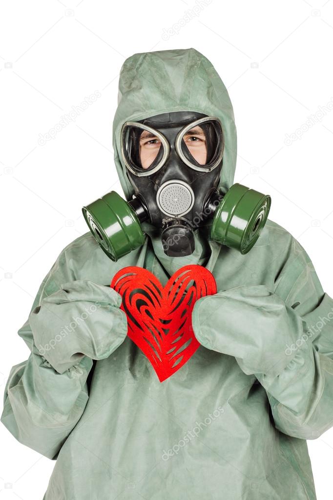 Man with protective mask and protective clothes with red heart