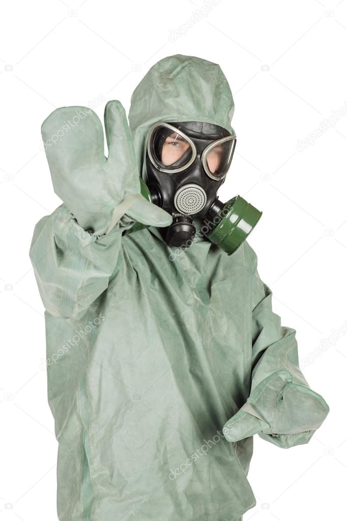 Man with protective mask and protective clothes signaling a stop