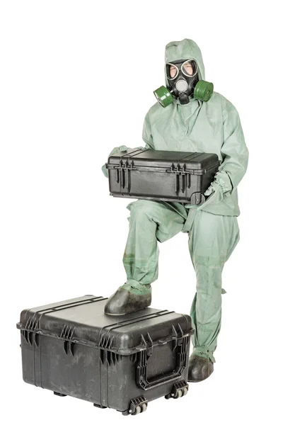 Man with protective mask and protective clothes prepares equipment for work. — Stock Photo, Image