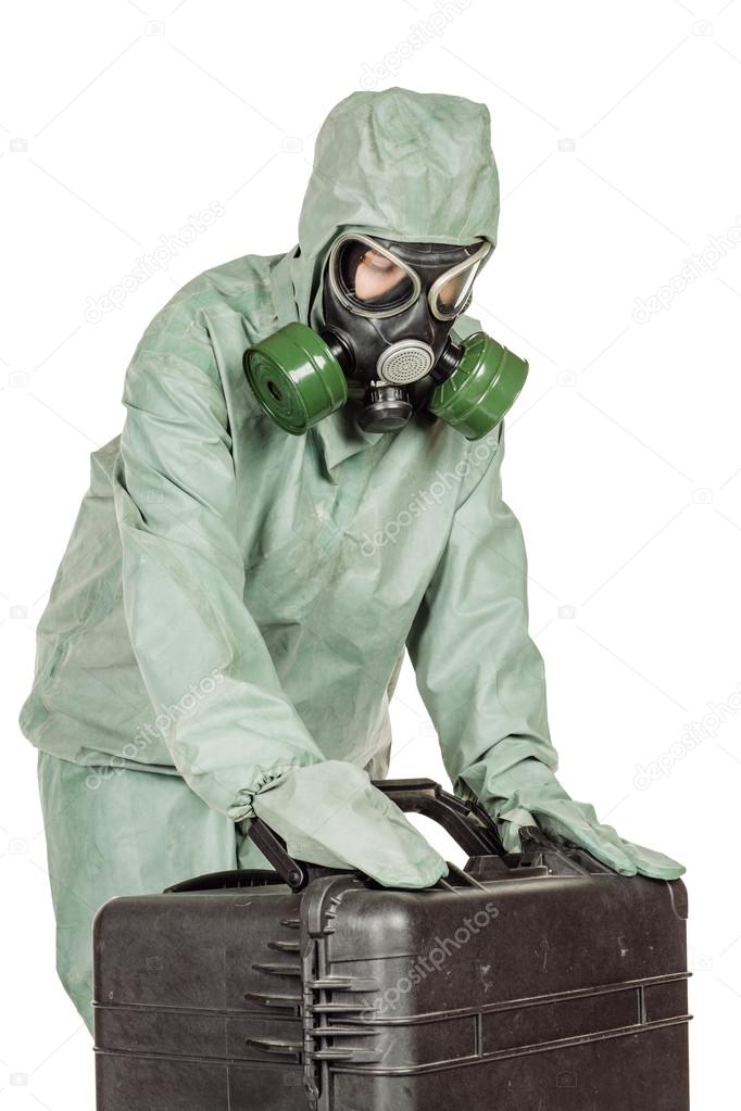 Man with protective mask and protective clothes prepares equipment for work.