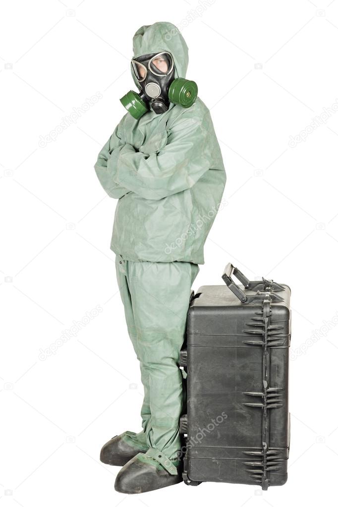 Man with protective mask and protective clothes prepares equipment for work.