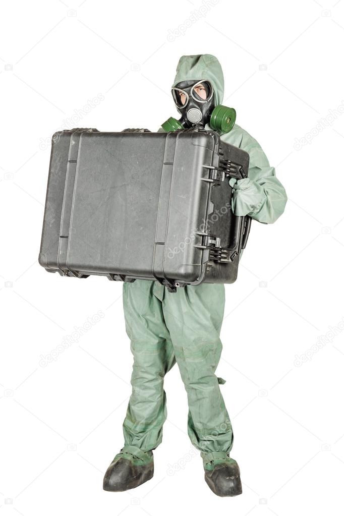 Man with protective mask and protective clothes prepares equipment for work