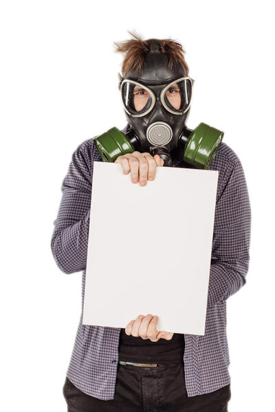 Man with protective gas holding a blank sheet of paper.
