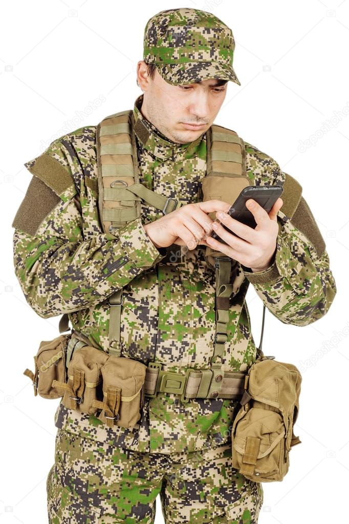 Russian Army soldier wearing multicam camouflage on his mobile c