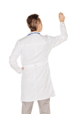 Young  male doctor in white coat writing on blank glass board or