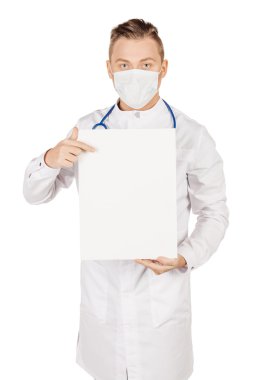 Medical doctor in white coat with stethoscope and mask holding b