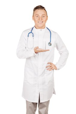 Medical doctor in white coat with stethoscope holding something 