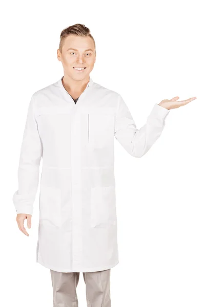 Medical doctor in white coat with stethoscope holding something — Stock Photo, Image
