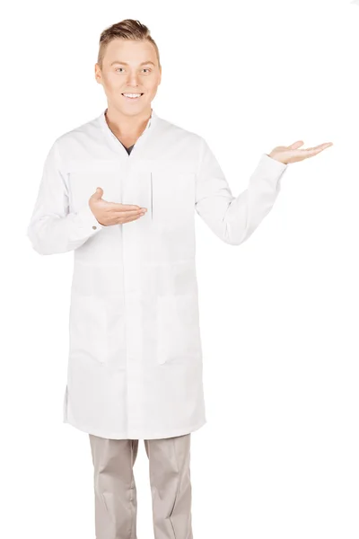 Medical doctor in white coat with stethoscope holding something — Stok fotoğraf