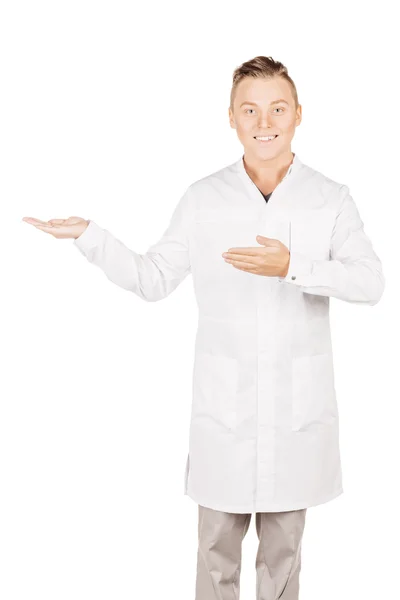 Medical doctor in white coat with stethoscope holding something — Stok fotoğraf