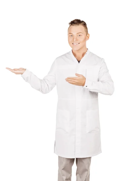 Medical doctor in white coat with stethoscope holding something — Φωτογραφία Αρχείου