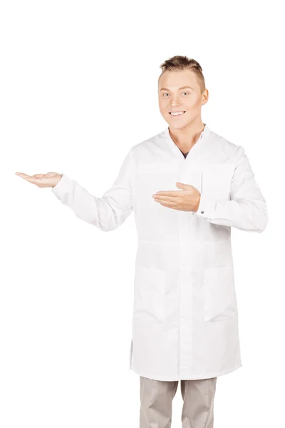 Medical doctor in white coat with stethoscope holding something — Stok fotoğraf