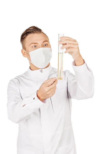 Medical doctor in white coat with stethoscope and mask holding a — Φωτογραφία Αρχείου