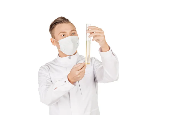 Medical doctor in white coat with stethoscope and mask holding a — Stock fotografie