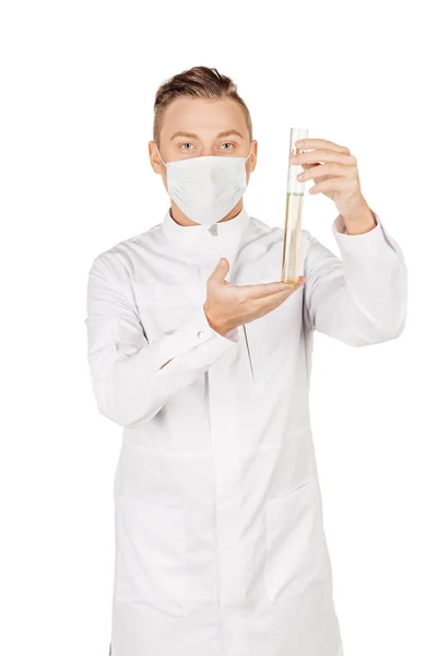 Medical doctor in white coat with stethoscope and mask holding a — Stock fotografie
