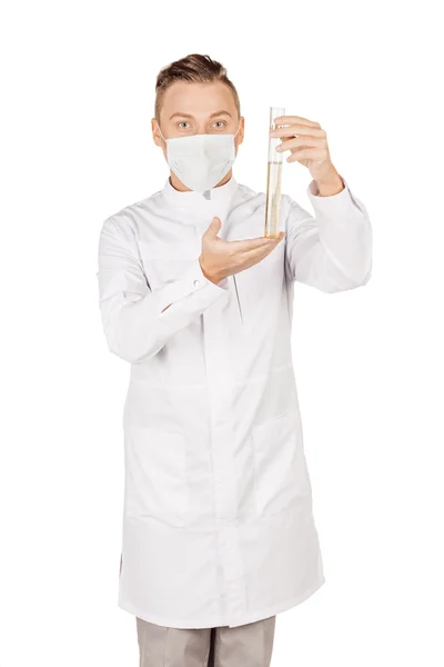 Medical doctor in white coat with stethoscope and mask holding a — Stock fotografie