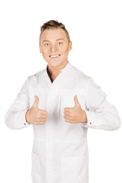 Νεαρός γιατρός αρσενικό σε λευκό παλτό εμφανίζονται αντίχειρες. Άνθρωποι και μου — Φωτογραφία Αρχείου