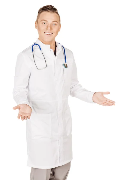 Young male doctor in white coat and stethoscope stretching hand — Stok fotoğraf