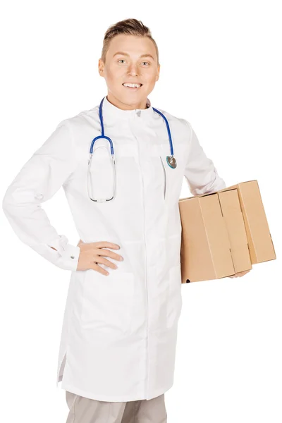 Young male doctor in white coat and stethoscope standing with pa — Stok fotoğraf