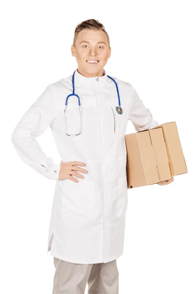 Young male doctor in white coat and stethoscope standing with pa — Stockfoto