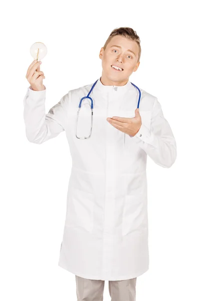 Young male doctor in white coat and stethoscope holding light bu — Stok fotoğraf