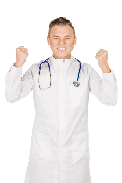 Tânăr doctor în haină albă şi stetoscop care arată pumnul. P — Fotografie, imagine de stoc